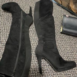 Express faux suede boots with elastic back and side zipper.